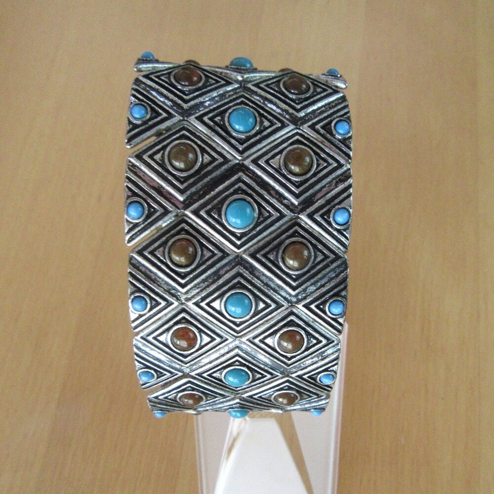 Silver tone cuff stretch bracelet with turquoise and brown beading - geometric